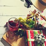 A glass of wine, grape, and presents. Now that your website is ready...