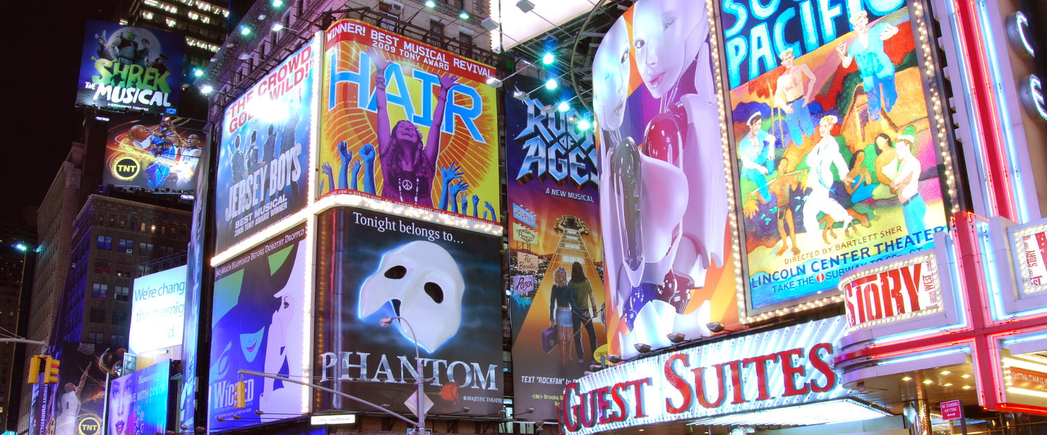 This picture depicts Times Square at night with many of its billboards light.